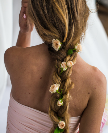 beautiful young girl with long hair flowers the tenderness of the mystery in a braid steed back